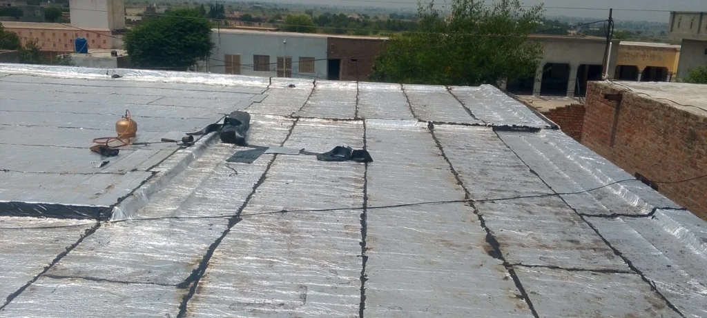 Roof Power Enterprises Pvt Ltd bitumen membrane application — professional roof waterproofing services Pakistan